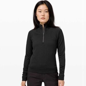 Lululemon black engineered wool half zip. Size 8.  Excellent Condition.